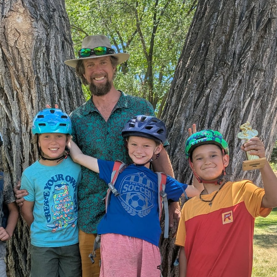 Chris with young riders after camp